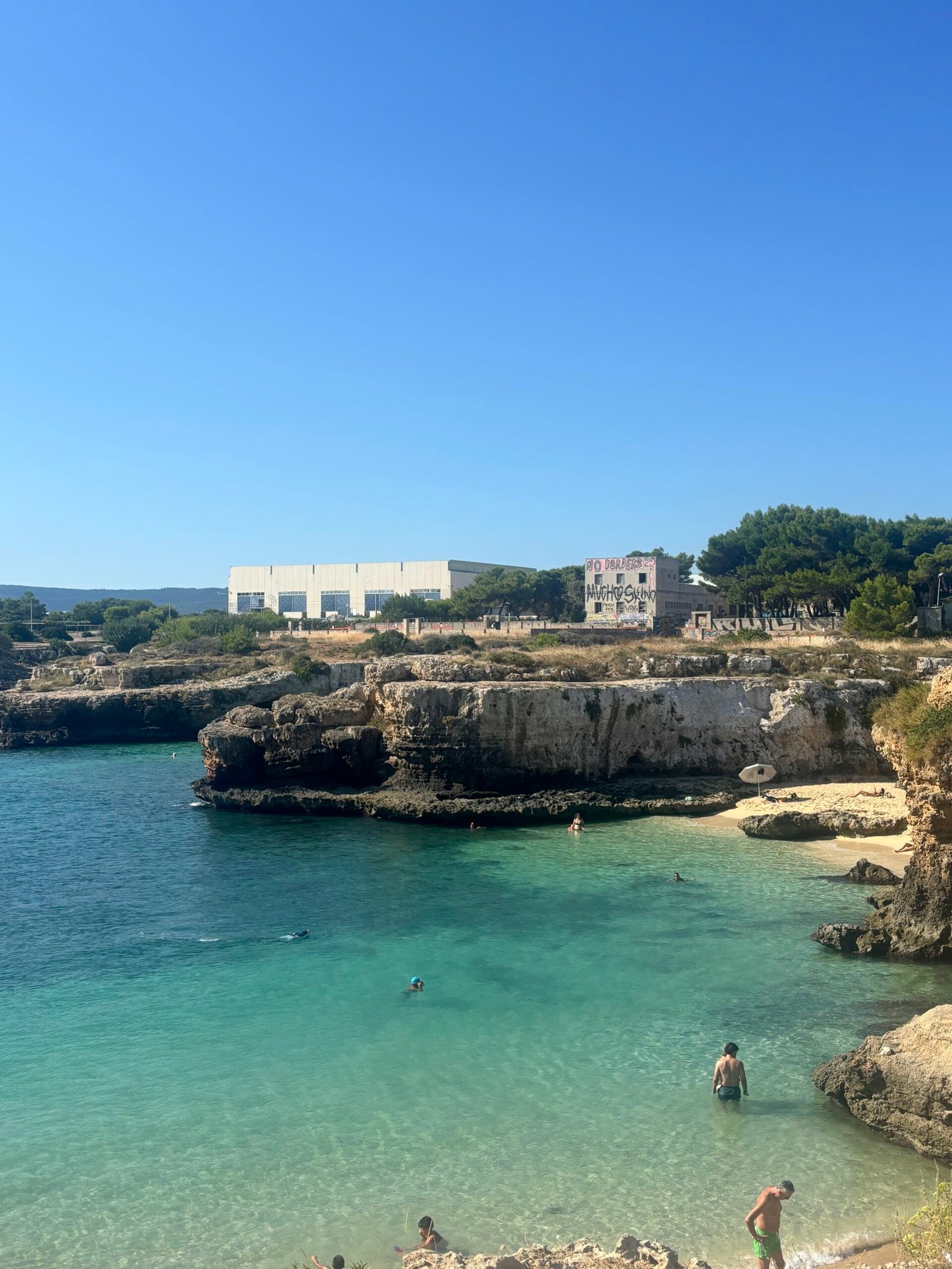 Beach cove in Puglia, Italy with clear turquoise water
